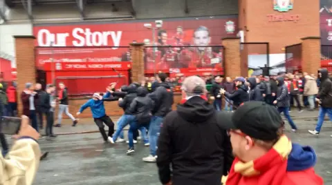 Liverpool fan stabbed after Roma fans attack supporters outside Anfield