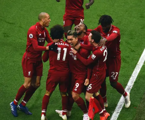 Photos: Liverpool rescue title bid with late Anfield winner against Spurs