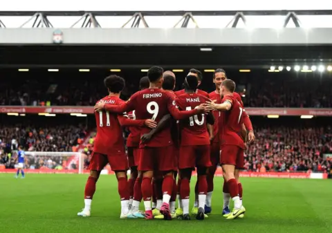 The best snaps from Anfield as Milner’s composure sees Reds earn late win