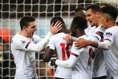 The best photos as Robertson and Mane give Liverpool dramatic Villa win