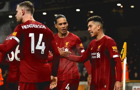 The best photos as Roberto Firmino strike gives relentless Reds 2-1 win over Wolves