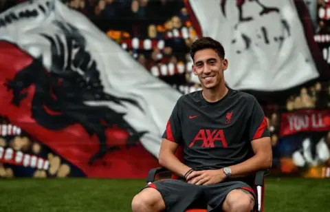 Liverpool complete £11.75million signing of Greek left-back Kostas Tsimikas