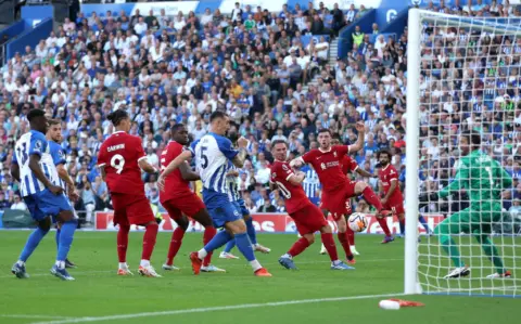 Lewis Dunk’s goal denies Liverpool come-from-behind victory at Brighton