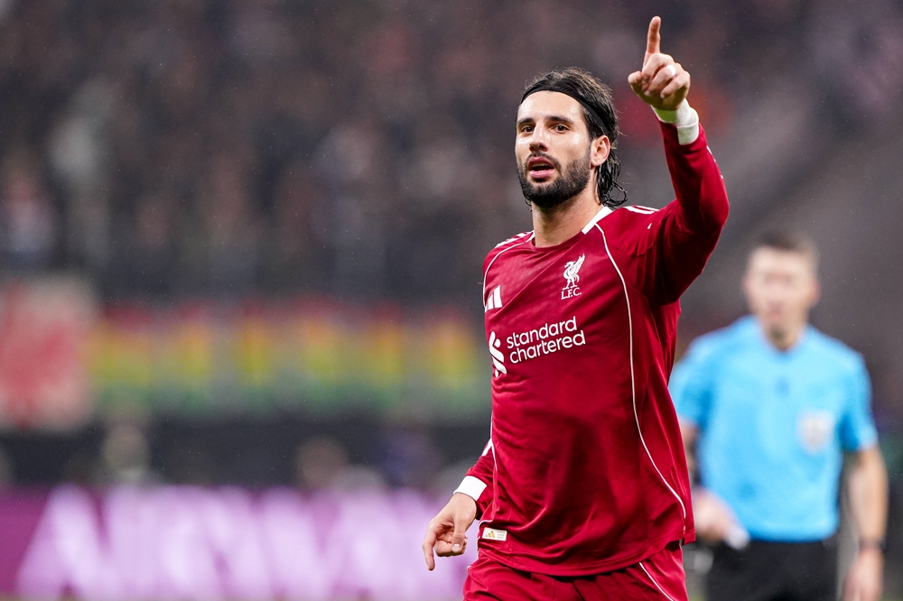 Dominik Szoboszlai looking focused on the pitch for Liverpool