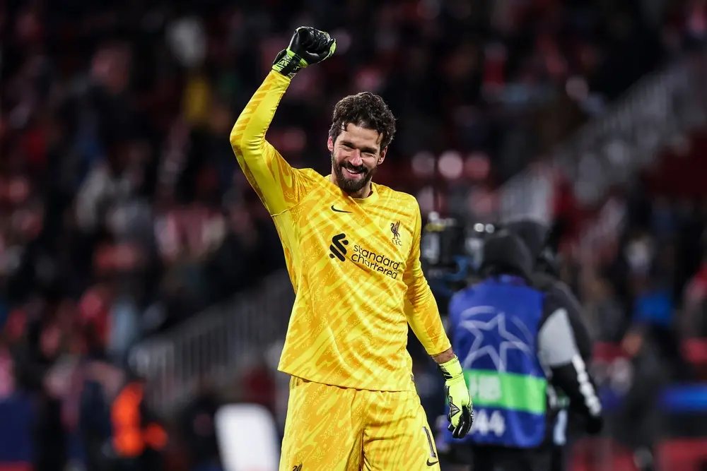 Alisson Becker waving to the fans at Anfield