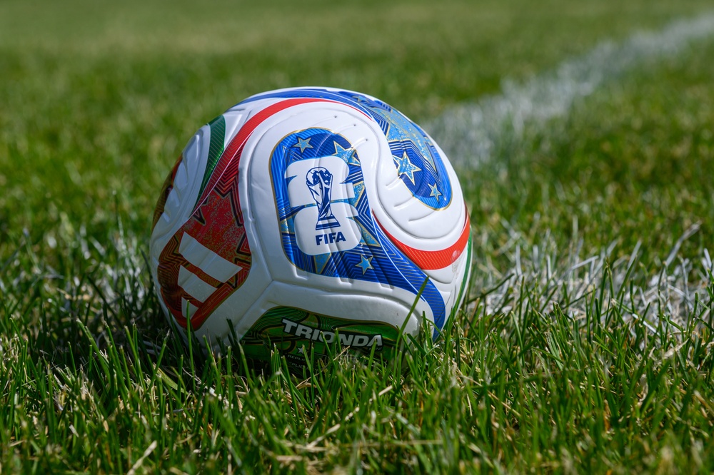 The official Trionda FIFA World Cup 2026 match ball on a green grass stadium pitch
