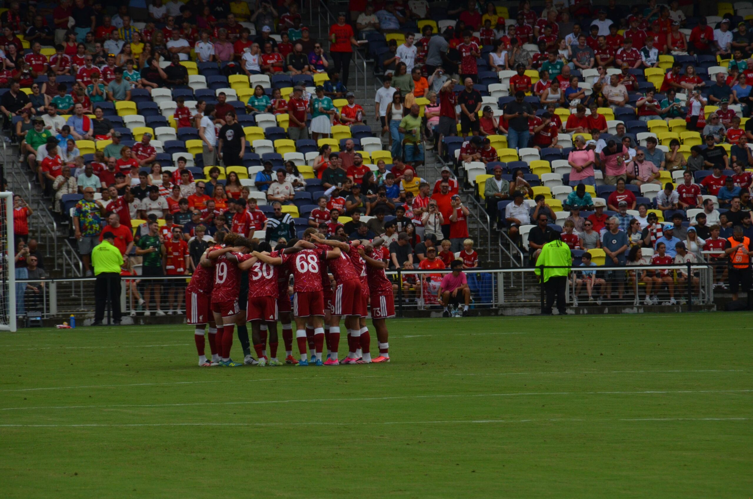 Liverpool players form a team huddle on the pitch at GEODIS Park before the pre-season match against Sunderland in Nashville