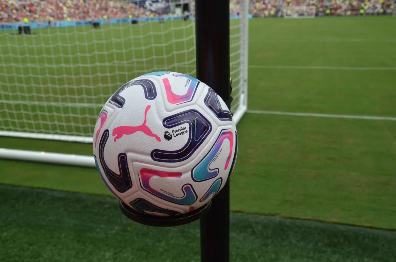 A Puma Premier League match ball resting on a stand on the pitch during the Liverpool USA Tour