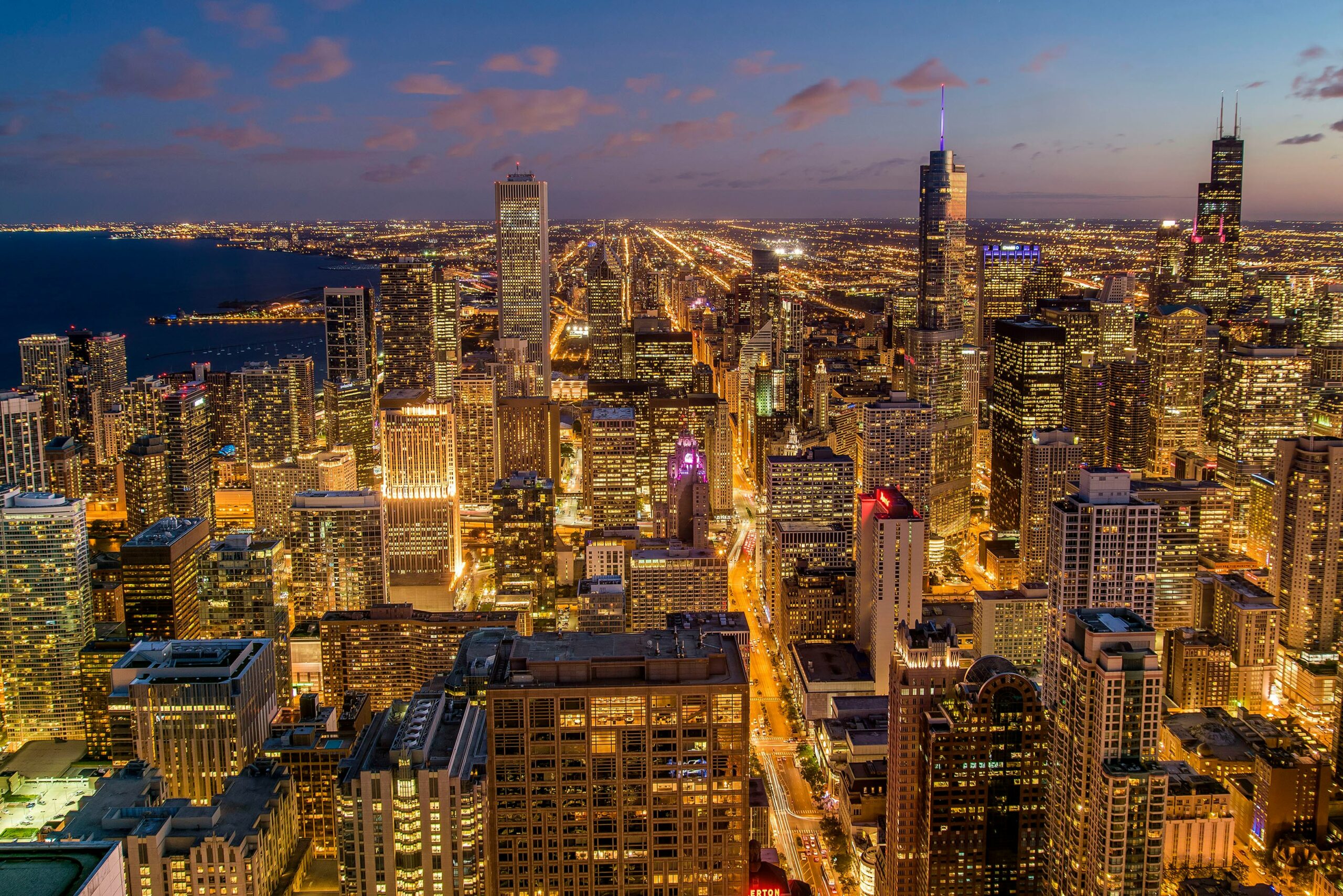 Aerial night view of the glowing Chicago skyline following Liverpool vs Leeds United at Soldier Field