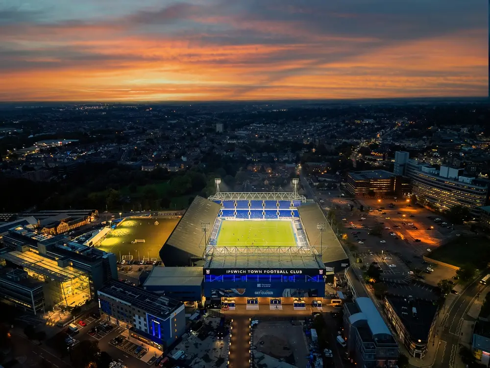 Twilight aerial view of Portman Road stadium ahead of Ipswich Town vs Liverpool FC kickoff