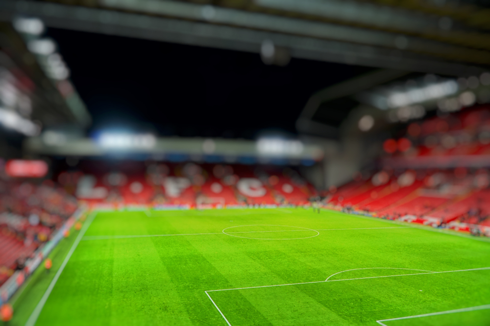 Anfield Stadium illuminated under floodlights ahead of Liverpool FC vs Atletico Madrid in the UEFA Champions League