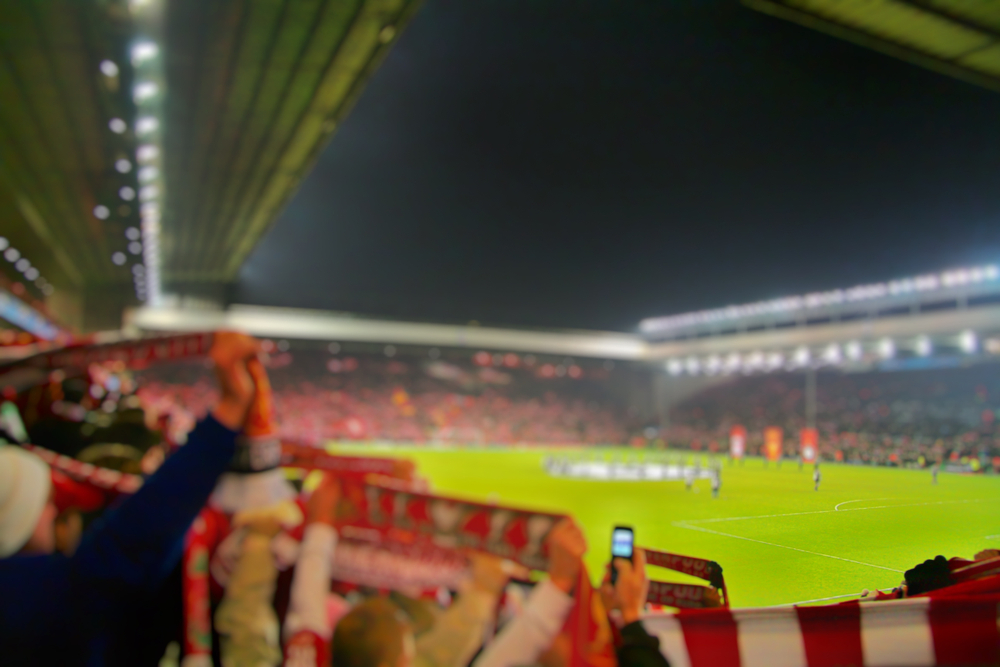 Anfield Stadium illuminated under floodlights for a European Champions League match between Liverpool FC and Atletico Madrid